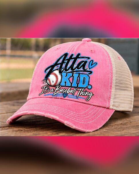 The pink Atta Kid trucker hat on the bench
