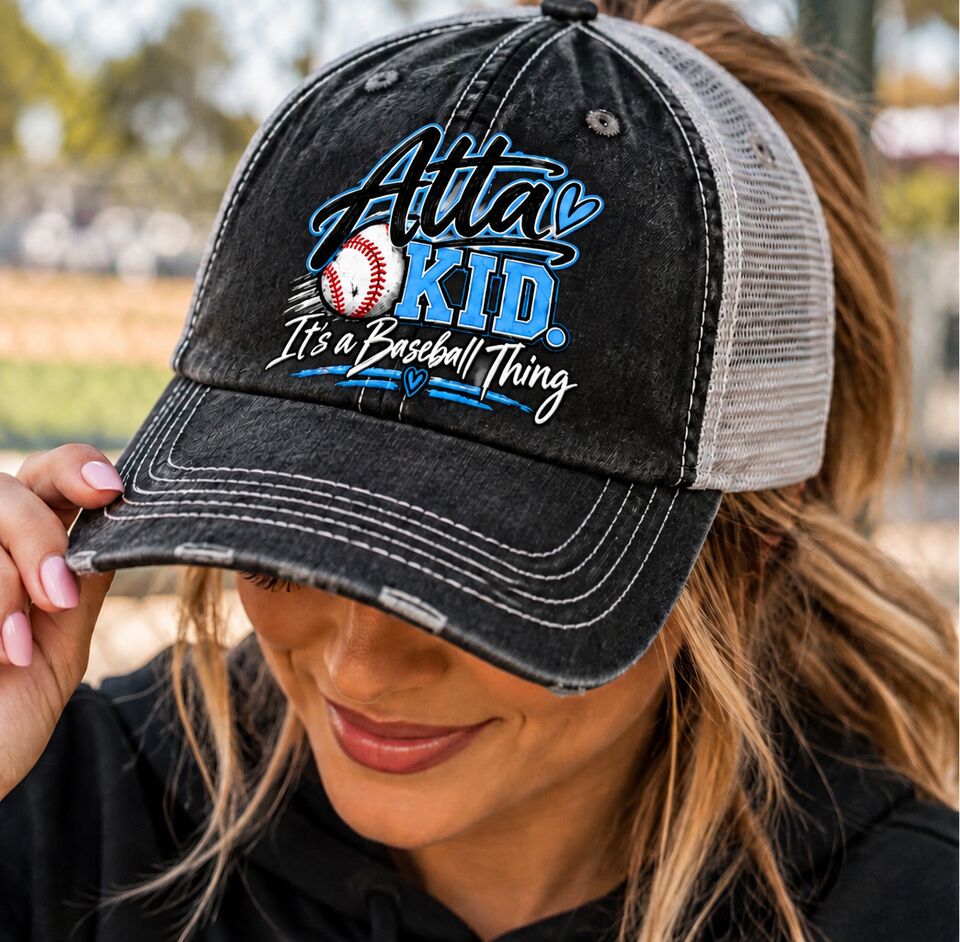 A mom in the black Atta Kid trucker hat